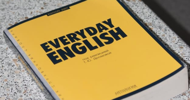 yellow book with the words "everyday english" written in the cover