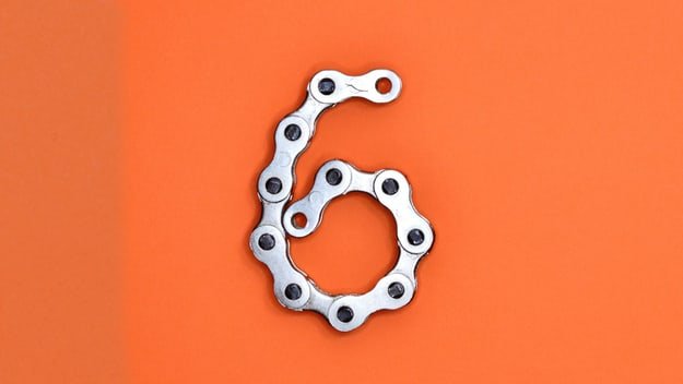 a bicycle chain forming the number six